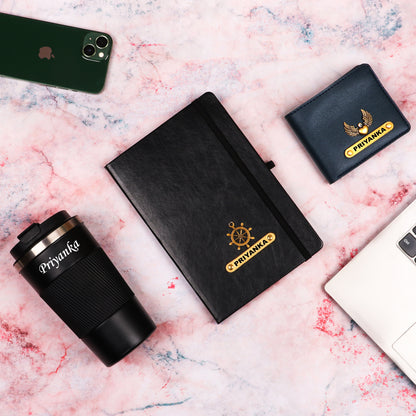Black diary with tumbler and dark blue wallet