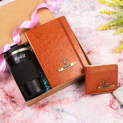 Black tumbler with tan diary and wallet