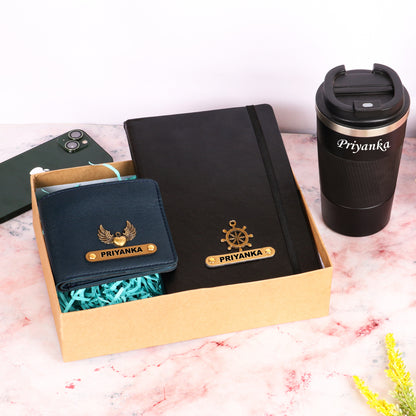 Black diary with tumbler and dark blue wallet