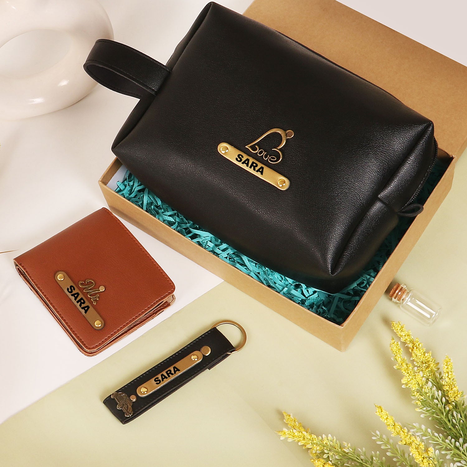 Black pouch and keychain with tan mens wallet